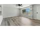 Open living room features wood-look floors, natural light, and neutral paint colors at 809 Greenbrook St, Las Vegas, NV 89110