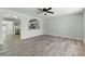 Bright living room features stylish flooring, modern ceiling fan and an open layout at 809 Greenbrook St, Las Vegas, NV 89110