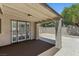 Covered patio with concrete floor, ceiling fan, and access to rear yard at 809 Greenbrook St, Las Vegas, NV 89110