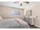 A cozy bedroom featuring a dresser and a window with blinds at 824 Antigua St, Las Vegas, NV 89145