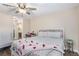 Bedroom featuring a comfortable bed and ceiling fan with a view to the bathroom at 824 Antigua St, Las Vegas, NV 89145