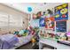 Fun bedroom with posters, toys, and a comfortable bed at 824 Antigua St, Las Vegas, NV 89145