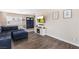 Open-concept living space with a plush sofa, media center, and attractive flooring at 824 Antigua St, Las Vegas, NV 89145