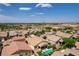 Birds eye view of a neighborhood featuring desert landscaping and a clear blue sky at 83 Buckthorn Ridge Ct, Las Vegas, NV 89183
