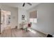 Small bedroom with a comfortable desk, a bright window, and wood-look floors at 83 Buckthorn Ridge Ct, Las Vegas, NV 89183