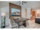 Cozy dining area highlighting an accent wall, a modern table set and seamless transition to the kitchen space at 83 Buckthorn Ridge Ct, Las Vegas, NV 89183