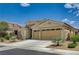 Attractive single-story home with a two-car garage, desert landscaping and a well-maintained front yard at 83 Buckthorn Ridge Ct, Las Vegas, NV 89183