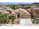 Beautiful home with desert landscaping, a spacious driveway and a three-car garage at 83 Buckthorn Ridge Ct, Las Vegas, NV 89183