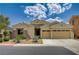 Inviting single-story home featuring a two-car garage, low maintenance landscaping, and stone facade details at 83 Buckthorn Ridge Ct, Las Vegas, NV 89183