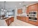 A well-appointed kitchen with stainless steel appliances and stone countertops overlooks the living area at 83 Buckthorn Ridge Ct, Las Vegas, NV 89183