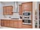 Contemporary kitchen with stainless steel appliances, a gas range, and convenient access to the pantry at 83 Buckthorn Ridge Ct, Las Vegas, NV 89183