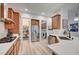 Bright kitchen with stainless appliances, a breakfast bar, a pantry and easy access to the laundry room at 83 Buckthorn Ridge Ct, Las Vegas, NV 89183