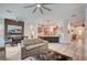 Open-concept living space boasting modern finishes, wood-look flooring and seamless flow to the kitchen and dining area at 83 Buckthorn Ridge Ct, Las Vegas, NV 89183