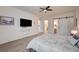 Spacious main bedroom featuring wood floors and direct access to the main bath and walk-in closet at 83 Buckthorn Ridge Ct, Las Vegas, NV 89183