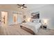 Serene bedroom with hardwood floors, a sliding barn door and convenient access to a walk-in closet at 83 Buckthorn Ridge Ct, Las Vegas, NV 89183