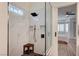 Modern shower featuring a rainfall shower head, built-in shelves, and a glass partition at 83 Buckthorn Ridge Ct, Las Vegas, NV 89183