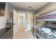 Bedroom with gray walls and carpet flooring, features a bunk bed and a door leading to the hallway at 8484 Montana Stream Ave, Las Vegas, NV 89113