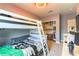Bedroom with bunk bed, desk, and closet space at 8484 Montana Stream Ave, Las Vegas, NV 89113
