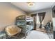 Bedroom with gray walls, bunk beds, window with curtains, and desk at 8484 Montana Stream Ave, Las Vegas, NV 89113