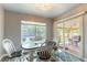 Cozy dining area with a table, chairs, and sliding glass doors to the outdoor space at 8484 Montana Stream Ave, Las Vegas, NV 89113