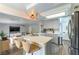 Bright kitchen with a peninsula, stainless steel appliances, ample counter space, and modern light fixtures at 8484 Montana Stream Ave, Las Vegas, NV 89113