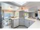 A bright kitchen with stainless steel appliances, a dining area, and backyard views at 8484 Montana Stream Ave, Las Vegas, NV 89113