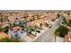 Charming neighborhood street view featuring well-maintained homes, desert landscaping and tile roofs at 8484 Montana Stream Ave, Las Vegas, NV 89113