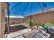 Backyard patio with dining, cooking and caged area; the ideal outdoor retreat at 889 Harbor Ave, Henderson, NV 89002