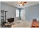 Bedroom featuring light blue walls, carpet floors, a window, ceiling fan, and a closet at 889 Harbor Ave, Henderson, NV 89002