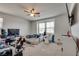 Bright bedroom with ceiling fan and natural light from large windows, perfect for relaxation at 889 Harbor Ave, Henderson, NV 89002