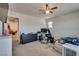 Bedroom featuring neutral walls, ceiling fan, and window to help control the temperature and lighting at 889 Harbor Ave, Henderson, NV 89002