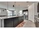 Bright eat-in kitchen featuring an island with pendant lighting and stainless steel appliances at 889 Harbor Ave, Henderson, NV 89002