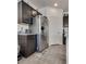 Another view of the Kitchen with stainless steel refrigerator and light granite countertops at 889 Harbor Ave, Henderson, NV 89002