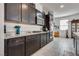 Well-equipped kitchen with granite counters, stainless appliances, a gas range, and ample cabinet space at 889 Harbor Ave, Henderson, NV 89002