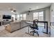 Open floorplan living room has sliding door and multiple windows at 889 Harbor Ave, Henderson, NV 89002