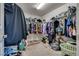 Large walk-in closet with ample shelving and hanging space, perfect for organizing your wardrobe and accessories at 889 Harbor Ave, Henderson, NV 89002