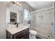 Bathroom featuring glass door shower, marble tile, and modern fixtures at 8953 Paige Rene Ct, Las Vegas, NV 89117