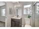 Contemporary bathroom featuring a vanity with dark wood doors and drawers, a shower and a toilet at 8953 Paige Rene Ct, Las Vegas, NV 89117
