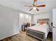 Comfortable bedroom with decorative ceiling fan, large bed, and natural light at 8953 Paige Rene Ct, Las Vegas, NV 89117