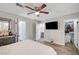 Bedroom with fan, plush bed, walk-in closet and an attached bathroom at 8953 Paige Rene Ct, Las Vegas, NV 89117