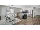 Modern kitchen and dining area with stainless steel appliances and breakfast bar at 8953 Paige Rene Ct, Las Vegas, NV 89117