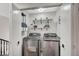 Modern laundry room equipped with high-efficiency washer and dryer and ample storage at 8953 Paige Rene Ct, Las Vegas, NV 89117
