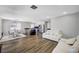 Open-concept living area with stainless appliances, dining area, and comfortable seating at 8953 Paige Rene Ct, Las Vegas, NV 89117