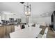 Spacious open floor plan with a modern kitchen and dining area, and comfortable living space at 8953 Paige Rene Ct, Las Vegas, NV 89117