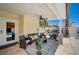 Outdoor patio area showcasing seating, exercise equipment, and a glimpse of the refreshing pool for active living at 8953 Paige Rene Ct, Las Vegas, NV 89117