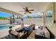 Inviting outdoor patio space with a covered seating area, pool access, and a well-designed entertainment zone at 8953 Paige Rene Ct, Las Vegas, NV 89117