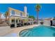 Inviting backyard featuring a private pool, covered patio, and comfortable seating area for relaxation at 8953 Paige Rene Ct, Las Vegas, NV 89117