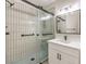 Modern bathroom with new vanity, shower, and matte black fixtures at 9220 Pitching Wedge Dr, Las Vegas, NV 89134