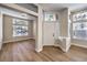 Inviting foyer with wood-look floors, bright windows, and a stylish front door at 9220 Pitching Wedge Dr, Las Vegas, NV 89134