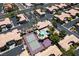 A beautiful aerial view shows the community pool, tennis courts, basketball court, and common areas at 9357 Golden Timber Ln, Las Vegas, NV 89117